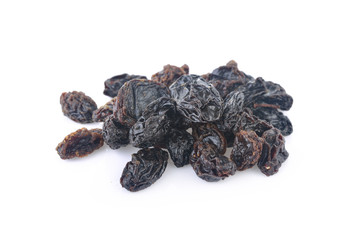 pile of dried raisins on white background