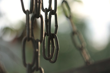 Old rusty steel chains with selective focus. Links or connections concept.