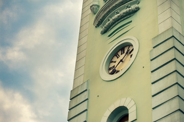 Tower old clock on background of blue sky with clouds