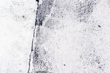 Crack in the concrete pavement as abstract background