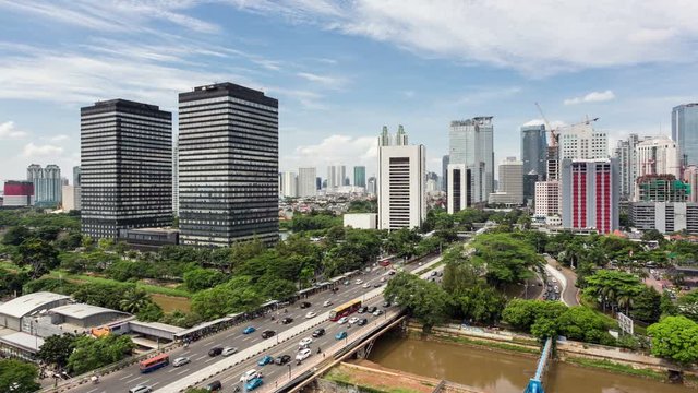 Traffic along Jalan Sudirman in Jakarta business district in Indonesia capital city. Shot as a time lapse video