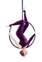 Woman hanging in aerial ring, isolated on white