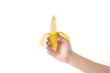Fototapeta na wymiar right hand holding banana with peel off skin on white background, selective focus