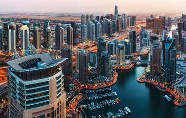 Foto op Plexiglas Fantastic view over illuminated architecture of a big city at night. Dubai Marina, United Arab Emirates. Scenic travel background. © Funny Studio