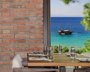 Modern restaurant interior with scenic seaside view