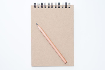 spiral notebook and pencil