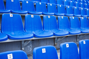 Perspective view of blue numbered seats on stadium
