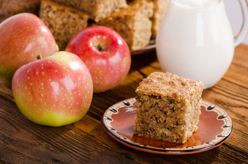 Piece of cake with milk and apples