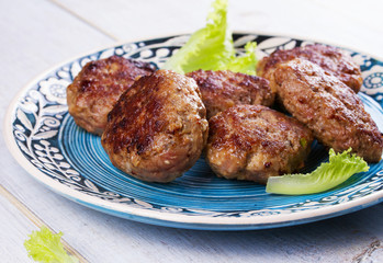 Beef and Pork Sausage Patties in Blue Plate