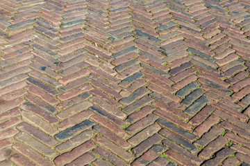 Old inlaid brick paving, Old  paving made of red bricks. Background concept. Architecture concept.