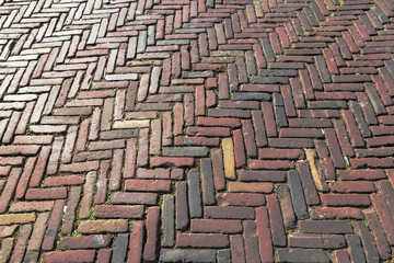 Old inlaid brick paving, Old  paving made of red bricks. Background concept. Architecture concept.