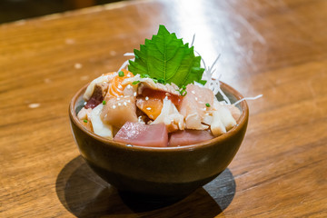 Chirashi sushi bowl with salmon, tuna, salmon roe and sweet omelette served with wasabi , Japanese Food.
