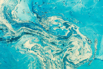 Blue marbling texture. Creative background with abstract oil painted waves, handmade surface. Liquid paint.