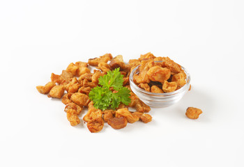 Fried pieces of pork rind and fat