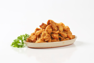 Fried pieces of pork rind and fat