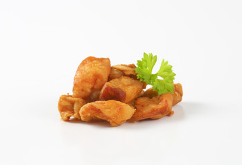 Fried pieces of pork rind and fat