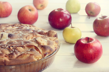 holiday Thanksgiving/ Fruit Tart and fresh apples on a light table 