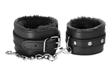 Pair of a black color leather handcuffs isolate on white background with clipping path.