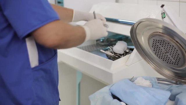 Doctor is preparing the tools for surgery