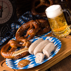 Bavarian sausage with pretzel, sweet mustard and beer