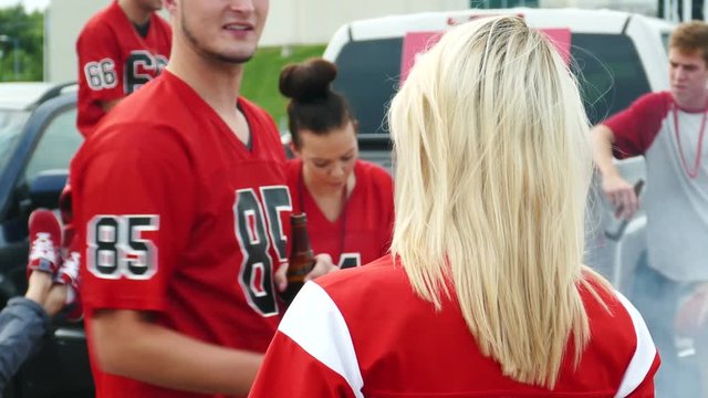 Extensive video series with football fans at a tailgate party, having fun.  Set in a parking lot outside an arena...Shot in 4k on Lumix FZ1000.