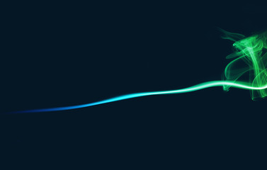 Abstract colored smoke on dark