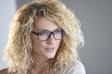 Portrait of attractive blond woman with eyeglasses, isolated