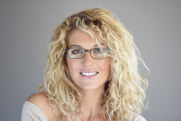 Obraz premium Portrait of attractive blond woman with eyeglasses, isolated