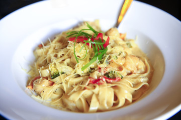 Vegetarian dish with tagliatelles, cheese and broccoli