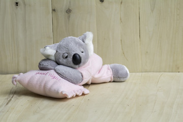 doll  Koala Sleeping on a pink pillow