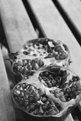 Red juicy pomegranate  fruit on wooden table