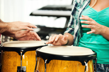 Playing congas. Close up.