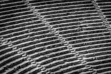Ancient theater Epidaurus, Argolida, Greece close-up view on rows in B&W