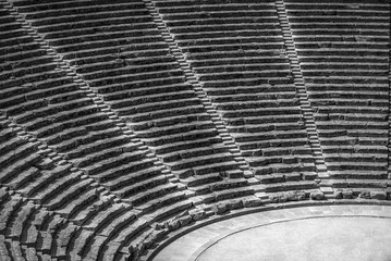 Ancient theater Epidaurus, Argolida, Greece side-view on rows in B&W