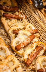 Sausages on bread with cheese