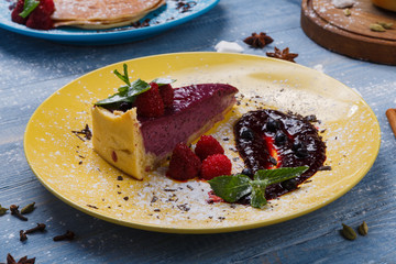 Restaurant dessert. Berry tart on blue wood