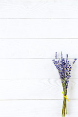 lavender on white wooden table with space for text