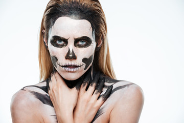 Portrait of girl with fearful skeleton makeup