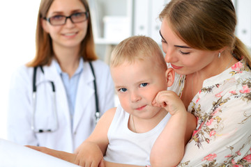 Little boy child  with his mother  after health exam at doctor's office