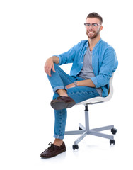 Young man sitting on the chair isolated over white background