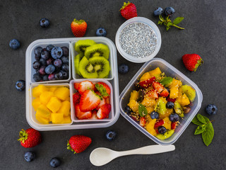Tasty raw fruits in plastic lunch box. Bento box. Take away food. Vegetarian food.