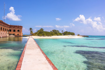Dry Tortugas National Park is situated at the southwest corner of the Florida Keys reef system and...