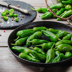 Raw green peppers jalapeno pimientos de padron traditional spanish tapas