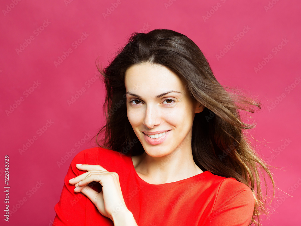 Wall mural pretty smiling girl in red dress