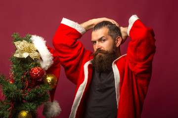 Man decorates Christmas tree