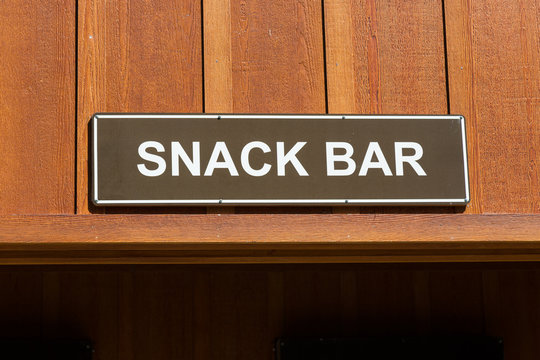 Brown and White Snack Bar Sign