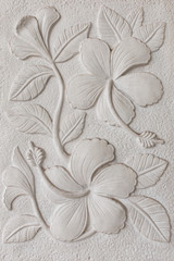 The White stucco wall flower
