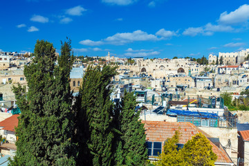 Fototapeta na wymiar Roofs of Old City with ancient wall gates, Jerusalem