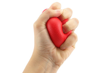 Woman hand squeezing a stress ball  on white background