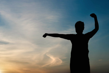 silhouette of woman Fitness to stand up in the sky.